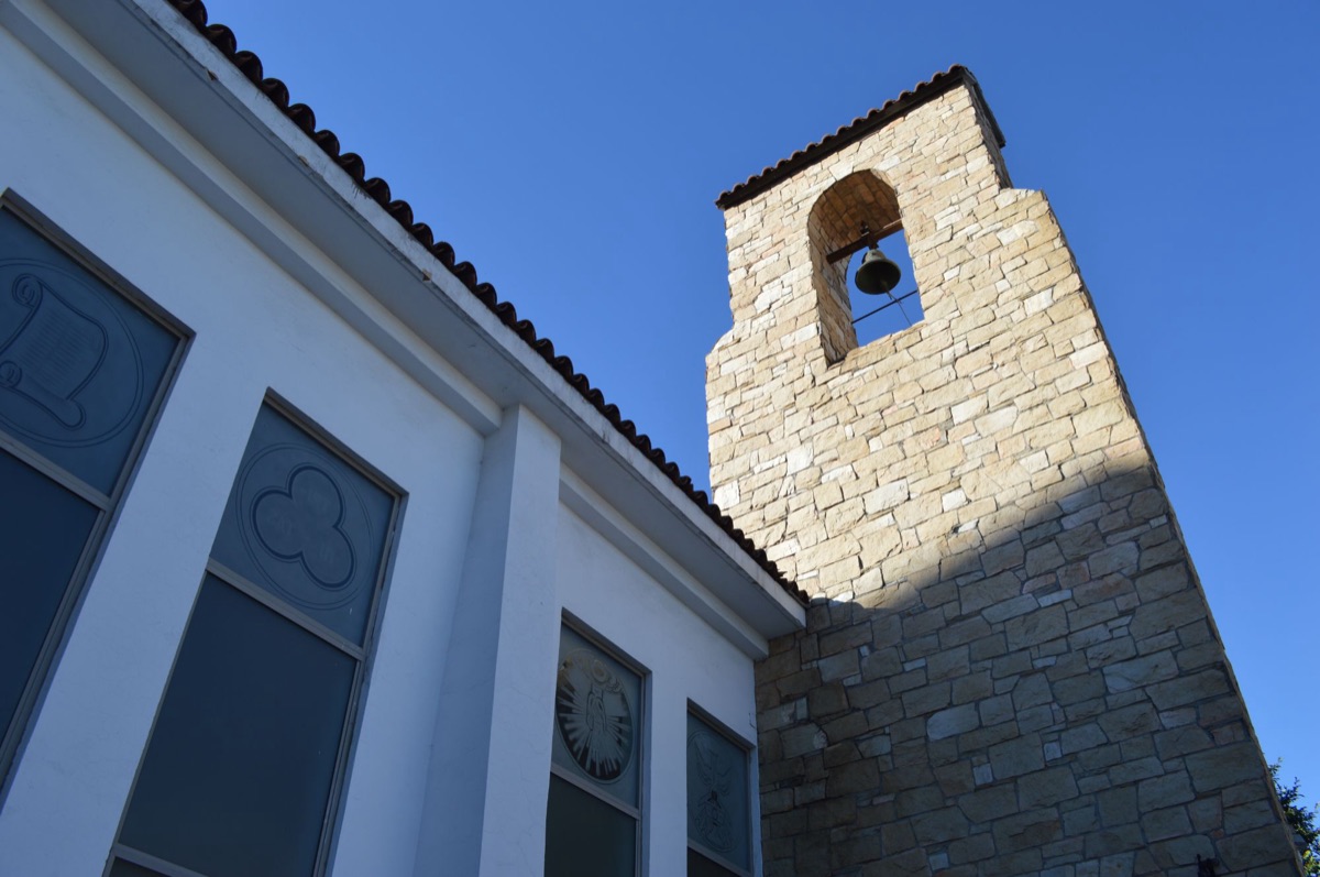 The church bell tower against a blue sky